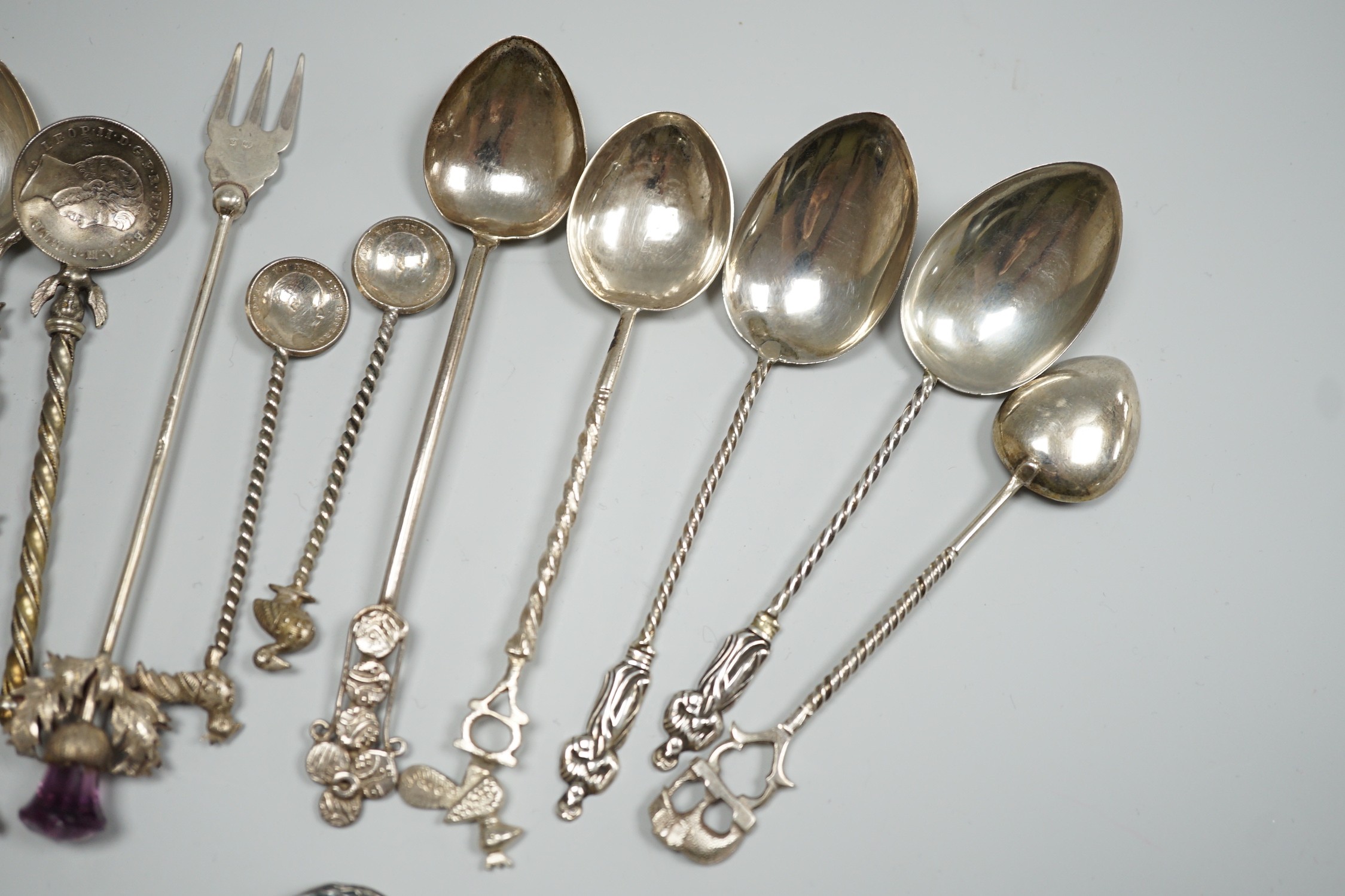 A collection of small silver and white metal spoons and forks including commemorative and three Art Nouveau silver buttons, Birmingham, 1901.